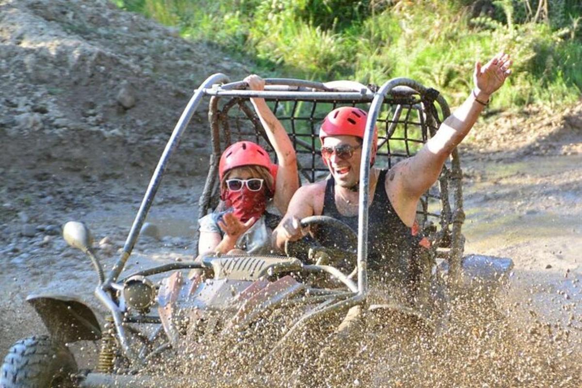 a man and a woman riding on a four wheeler