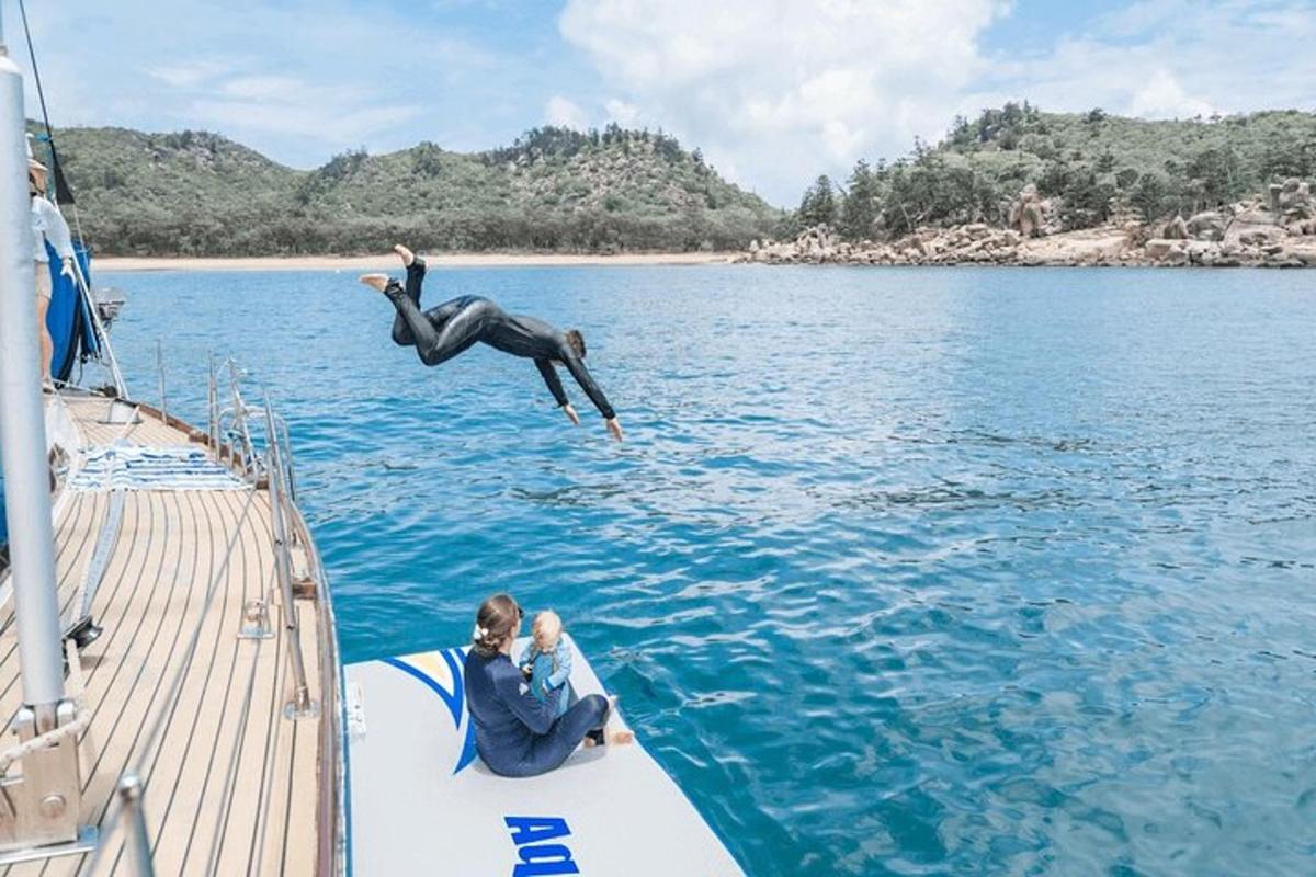 a person jumping off a boat into the water