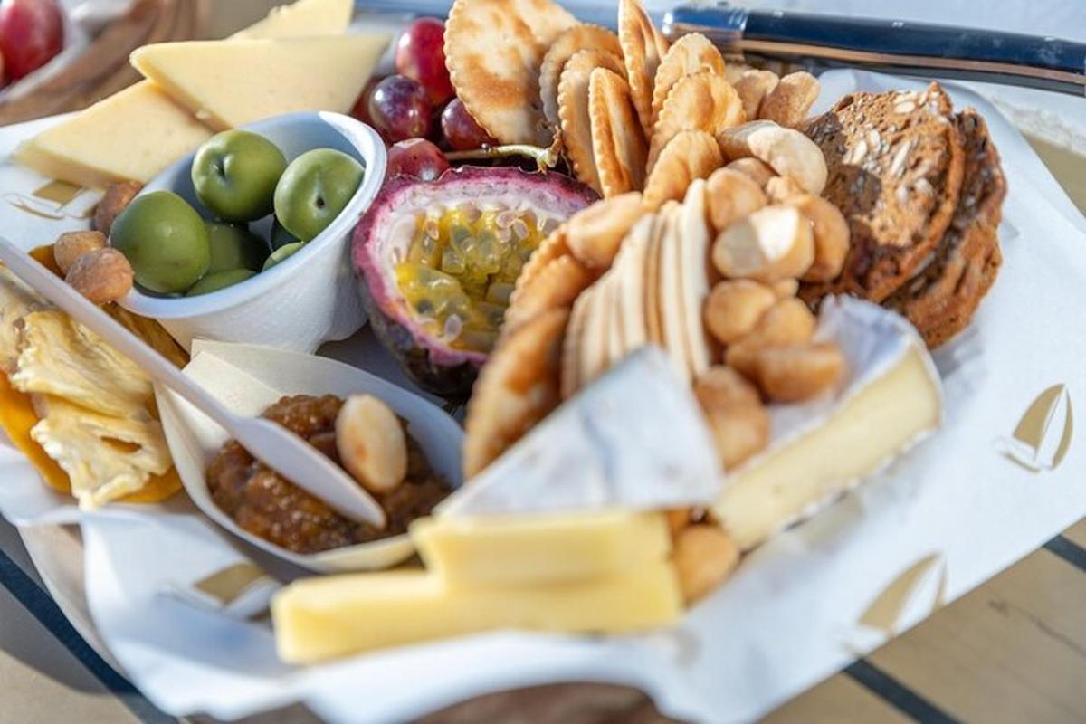 a plate of food with different types of bread and dips