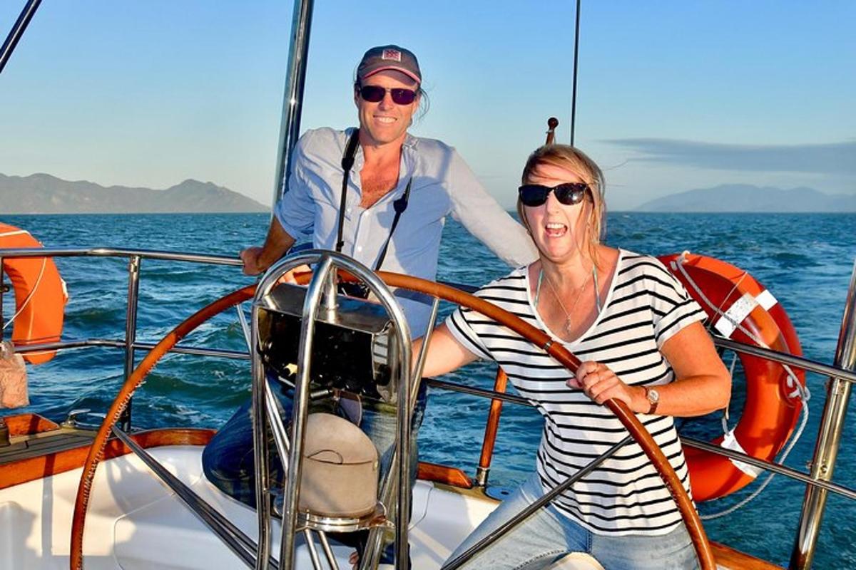 a man and woman on a boat in the water