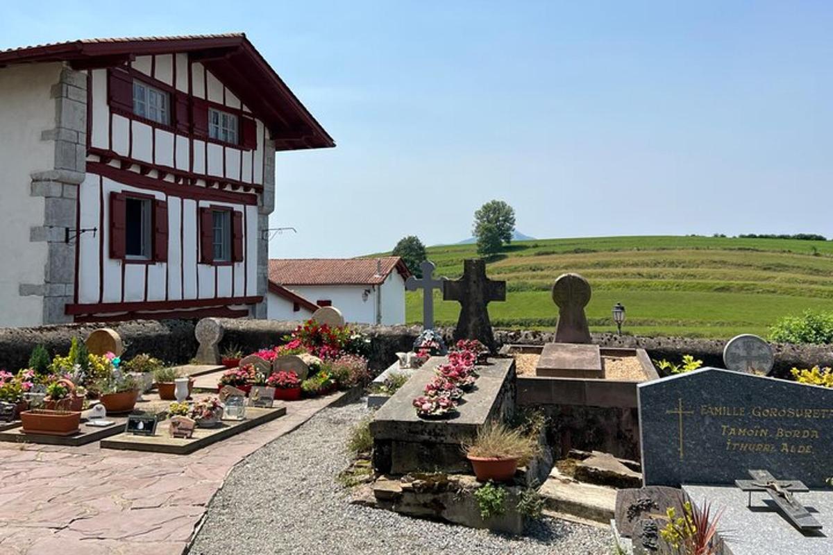 a cemetery in front of a building with a cross