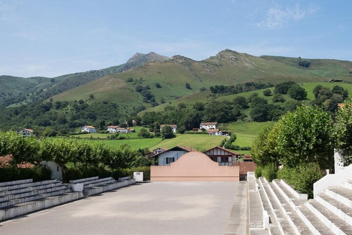 a parking lot with mountains in the background