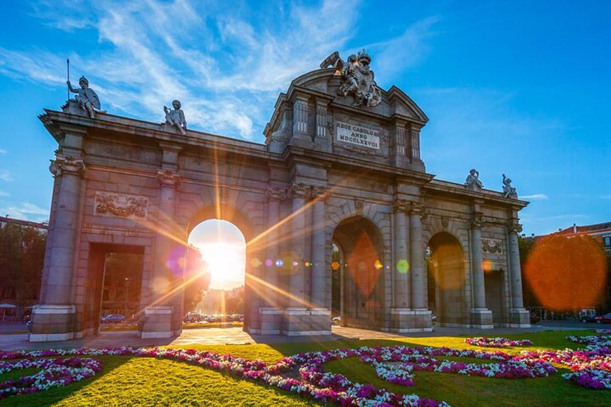a large building with the sun setting behind it