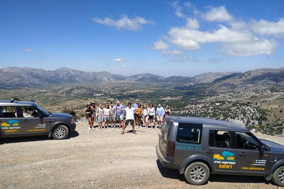 a group of people standing on the top of a mountain