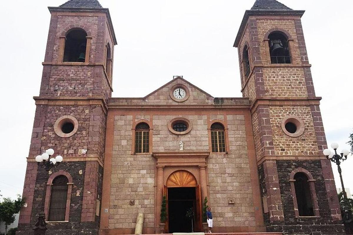 a large brick church with a clock tower