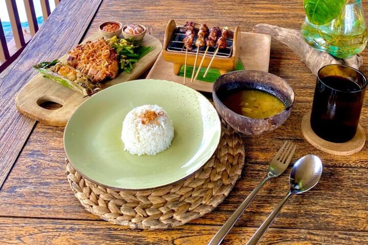 a table with a plate of rice and a plate of food