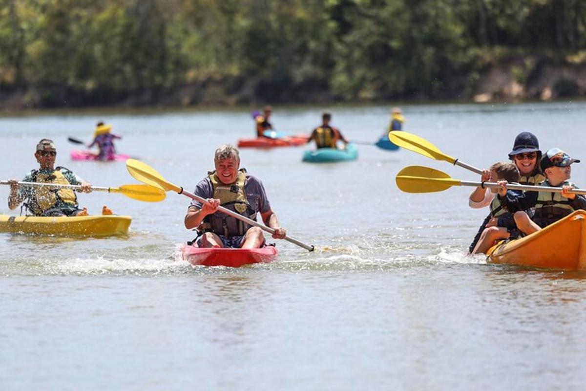 a group of people kayaking on a lake