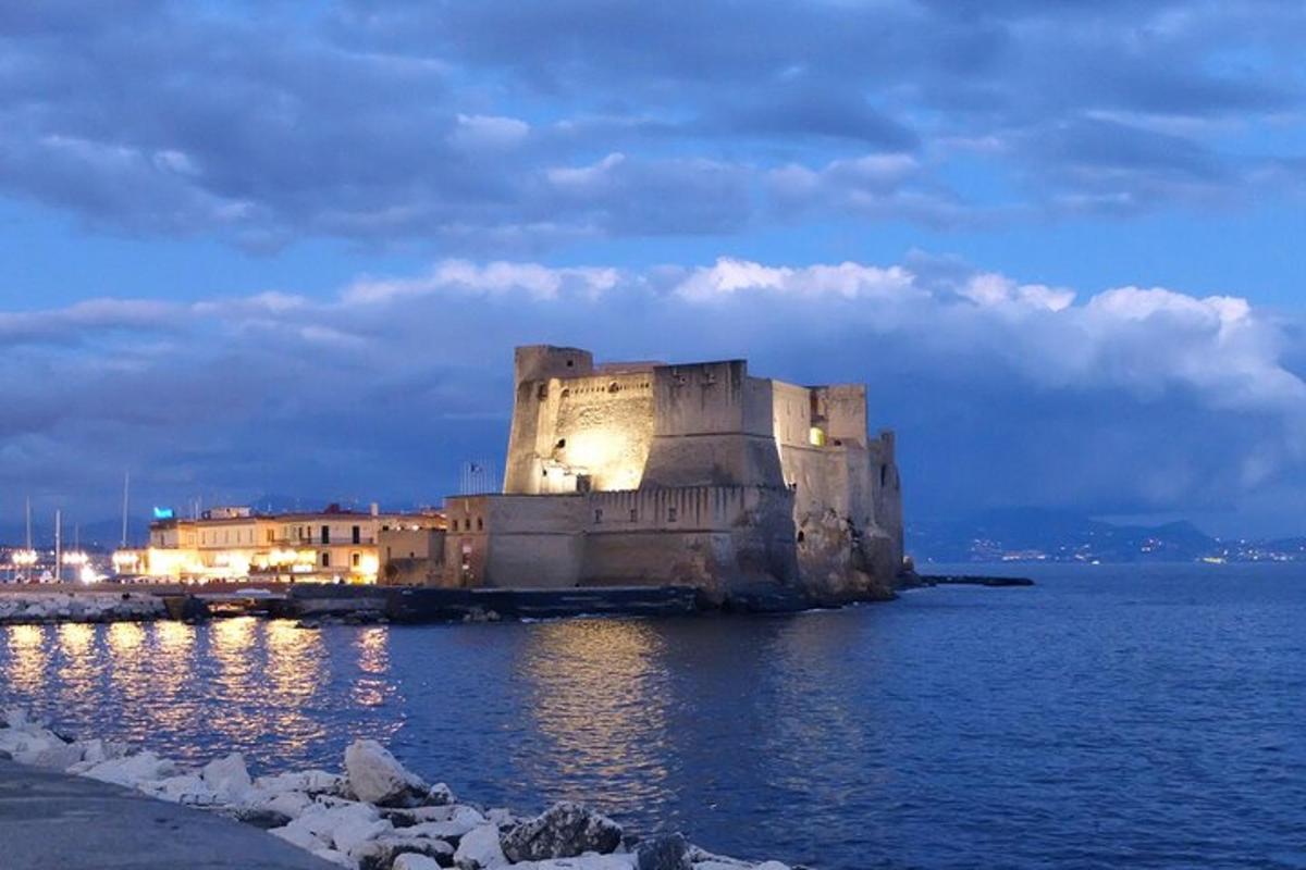 an old building sitting in the middle of the water
