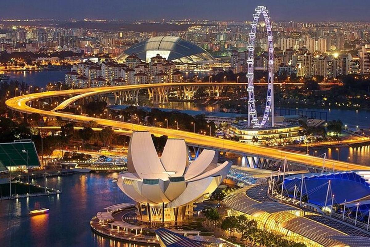 a view of a city at night with a bridge