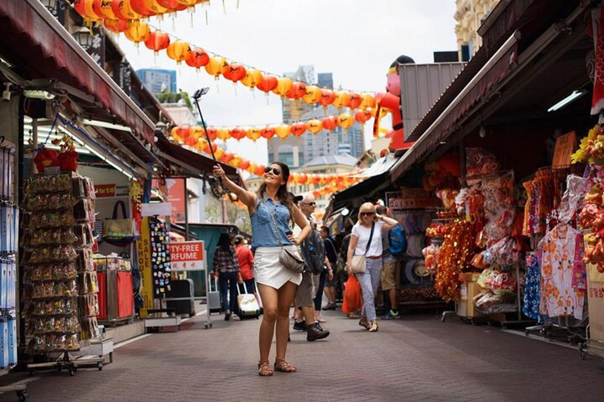 a woman walking down a street in a market