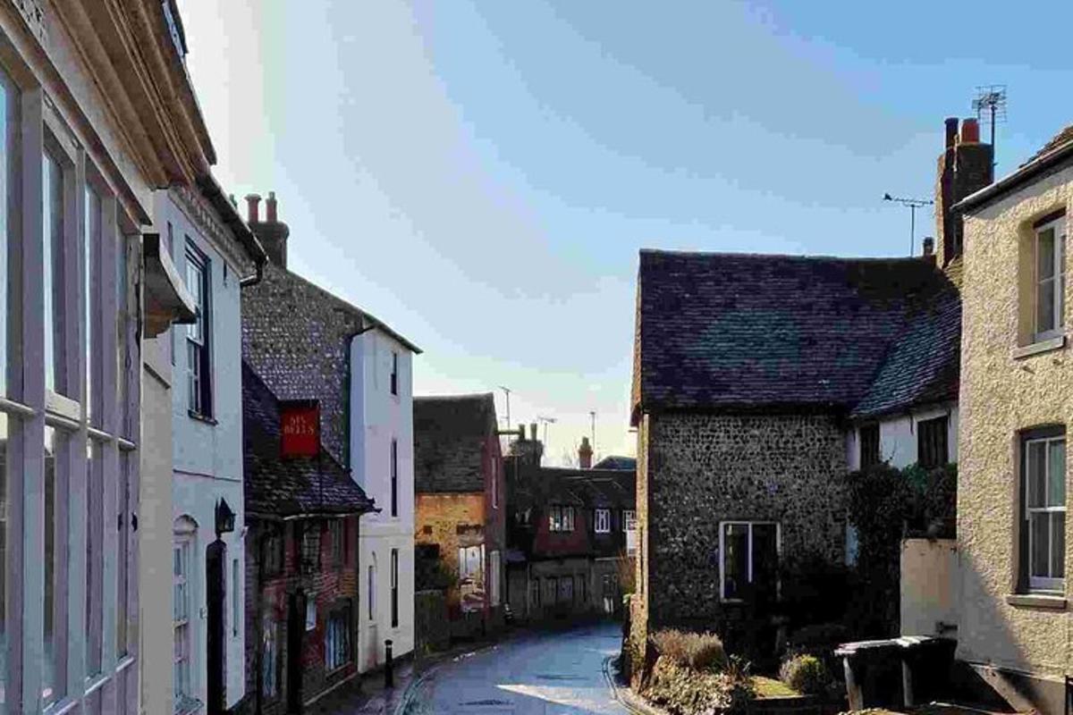 an empty street in an old town with buildings