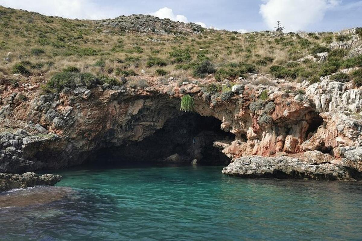 a cave in the side of a rocky cliff