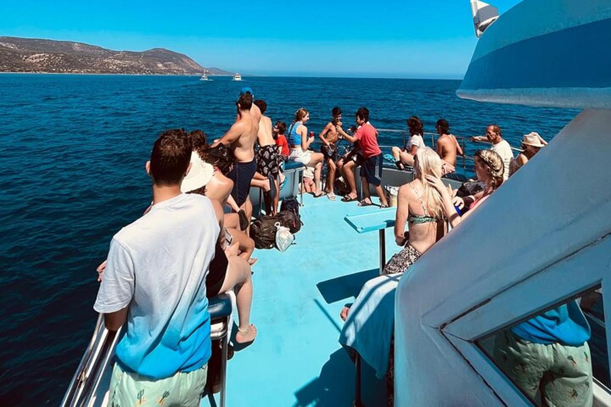 a group of people on a boat in the water