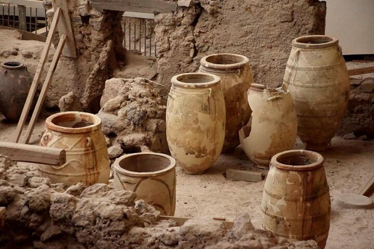 a group of vases sitting on the ground