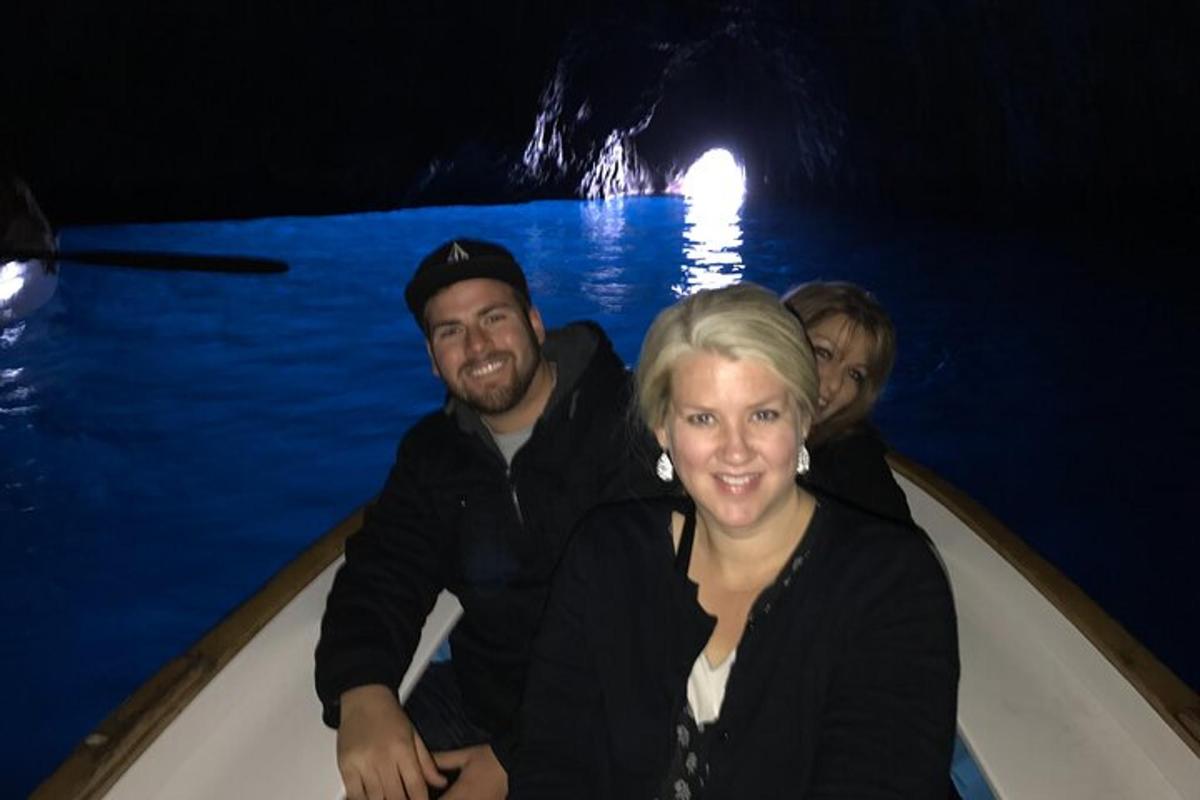 a man and a woman in a boat in a cave