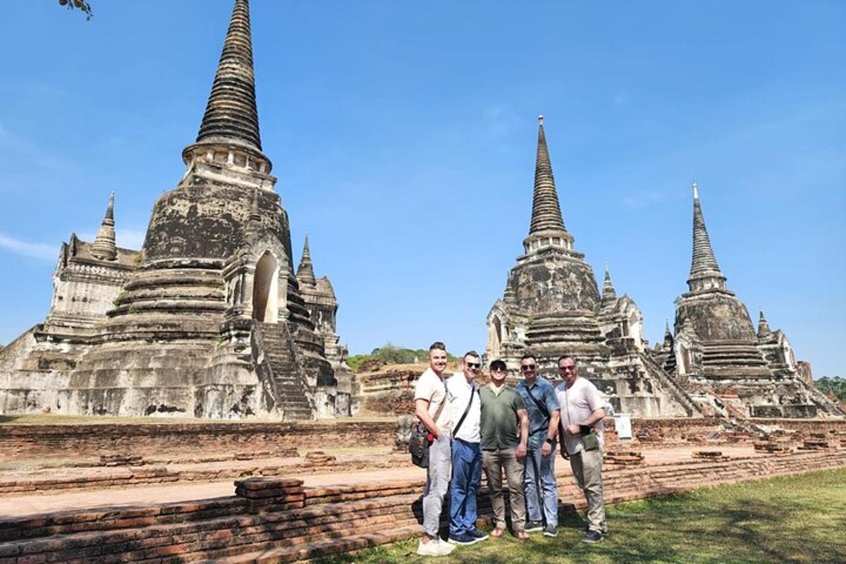 a group of people standing in front of a temple