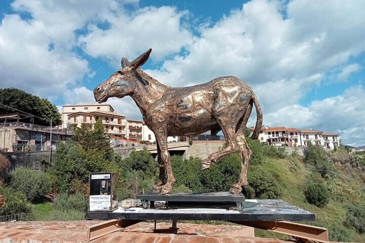a statue of a horse standing on a platform