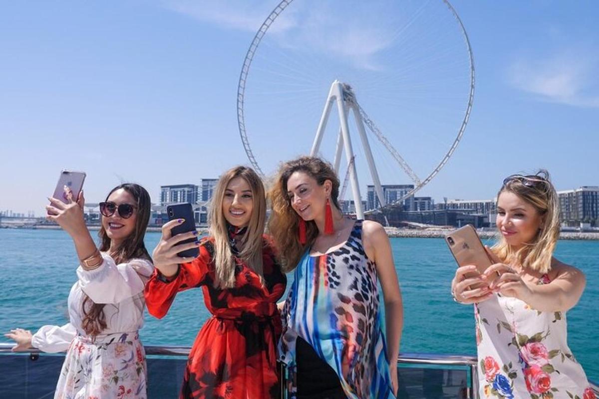 a group of women standing on a boat looking at their cell phones