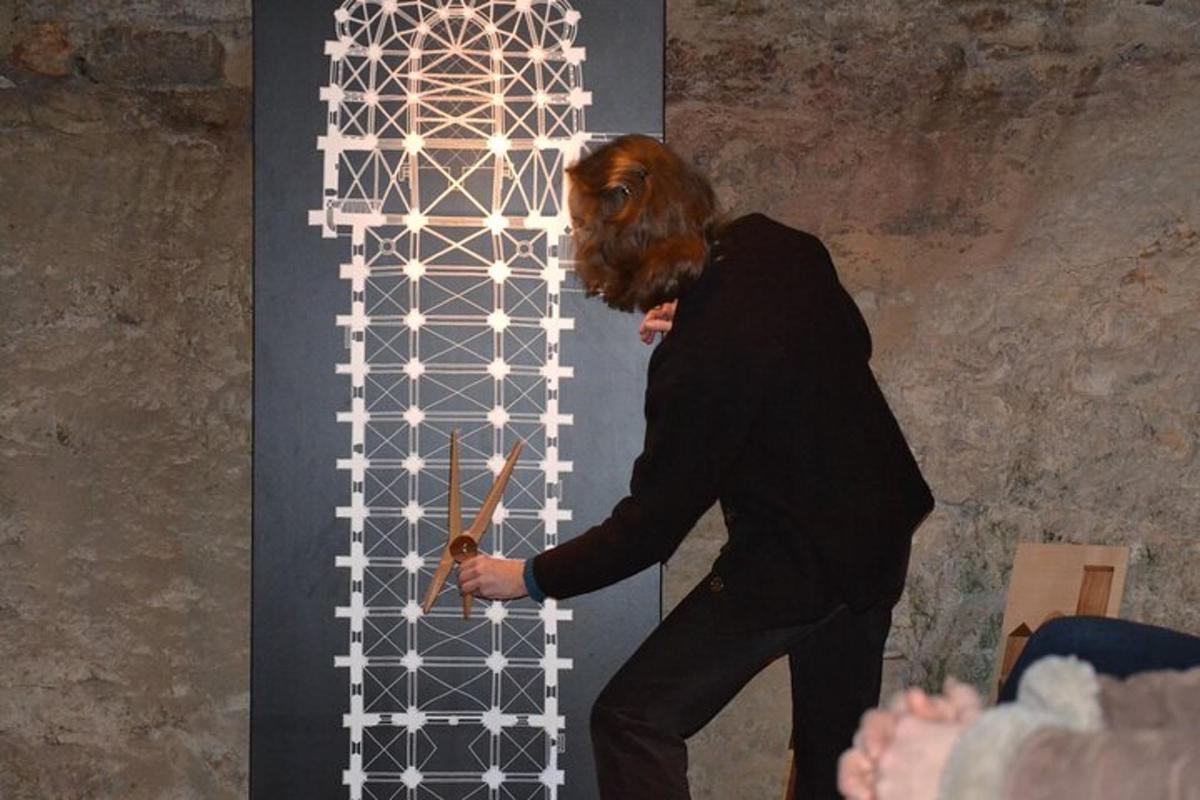 a man is standing in front of a wall