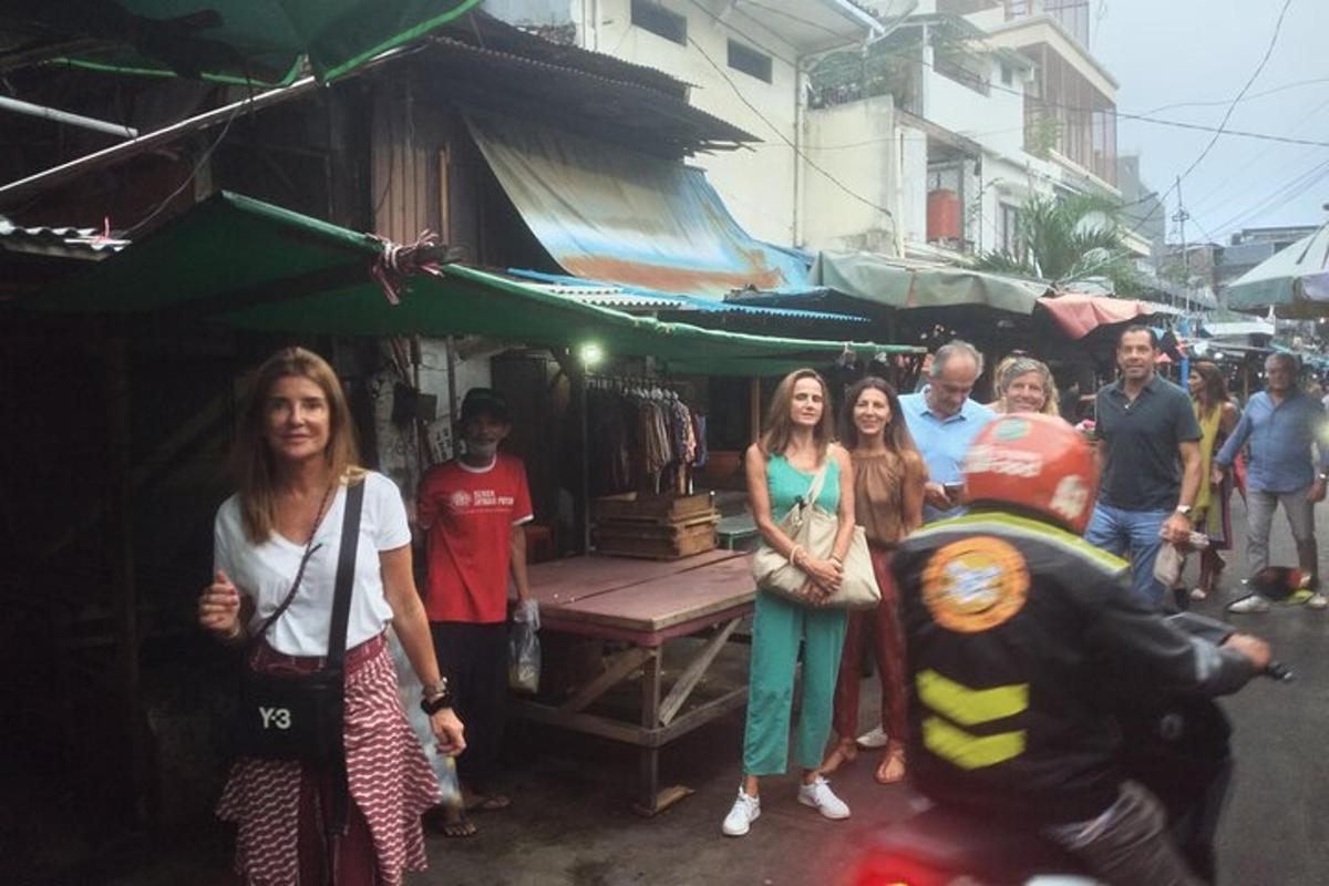 a group of people standing in a street