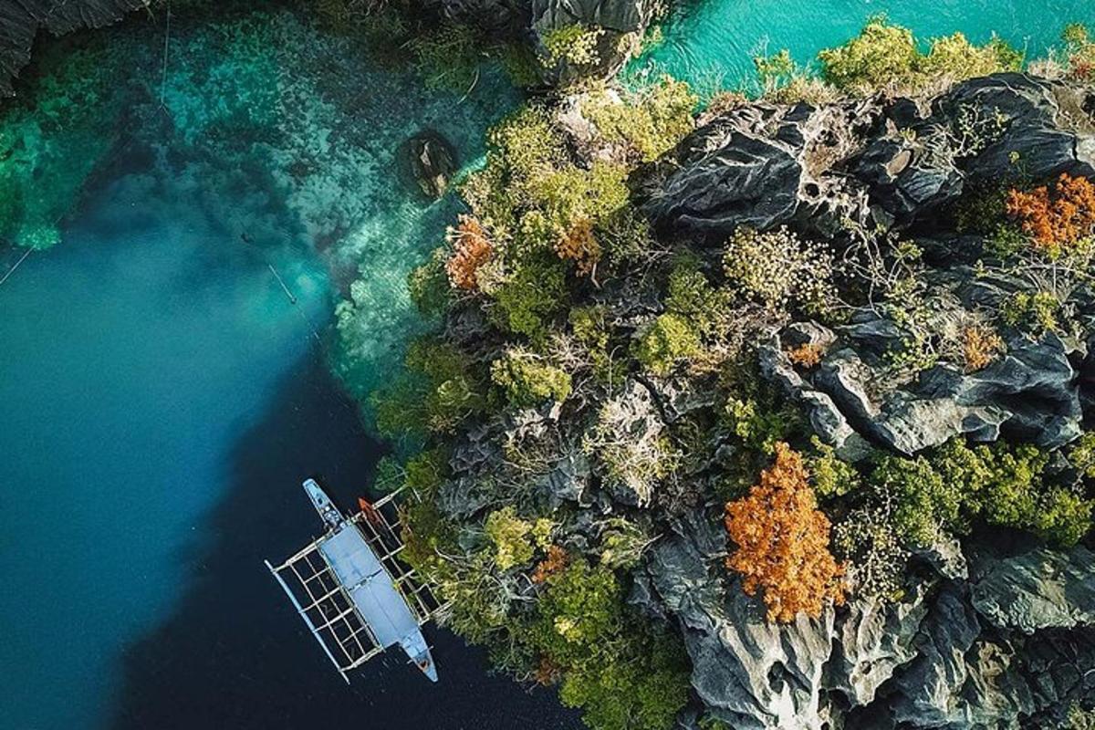 an aerial view of a boat in the water