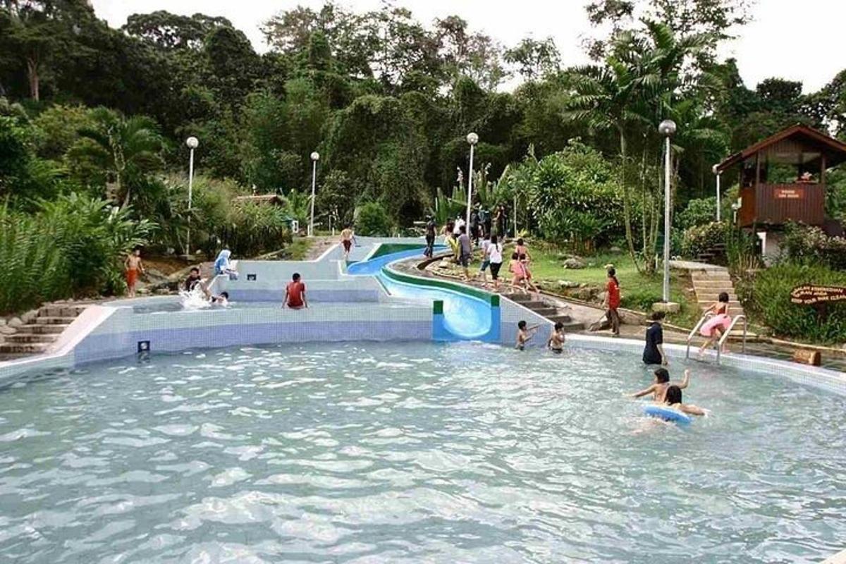 a group of people playing in a swimming pool