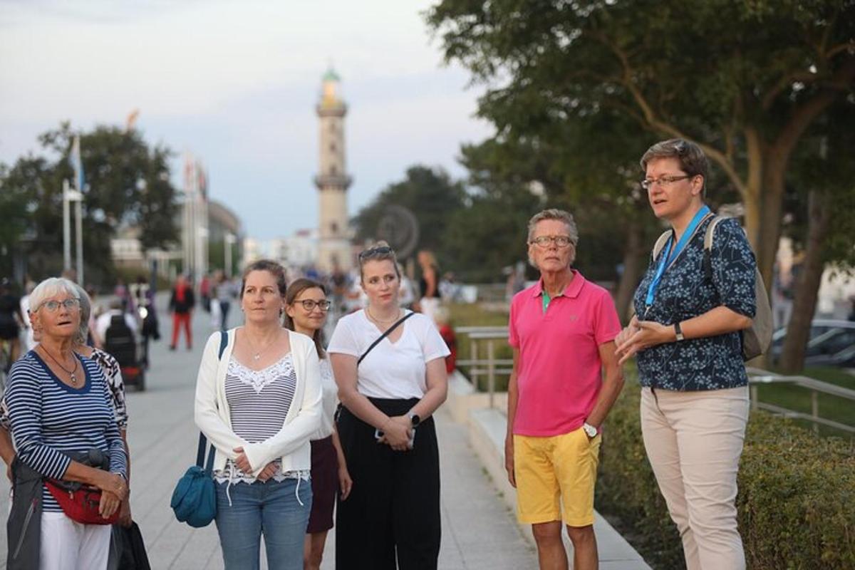 a group of people walking down a sidewalk