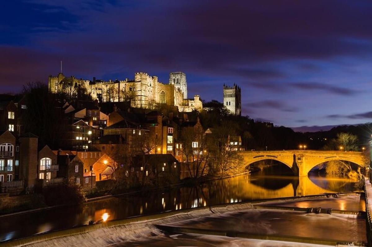 a view of a city with a bridge and a castle