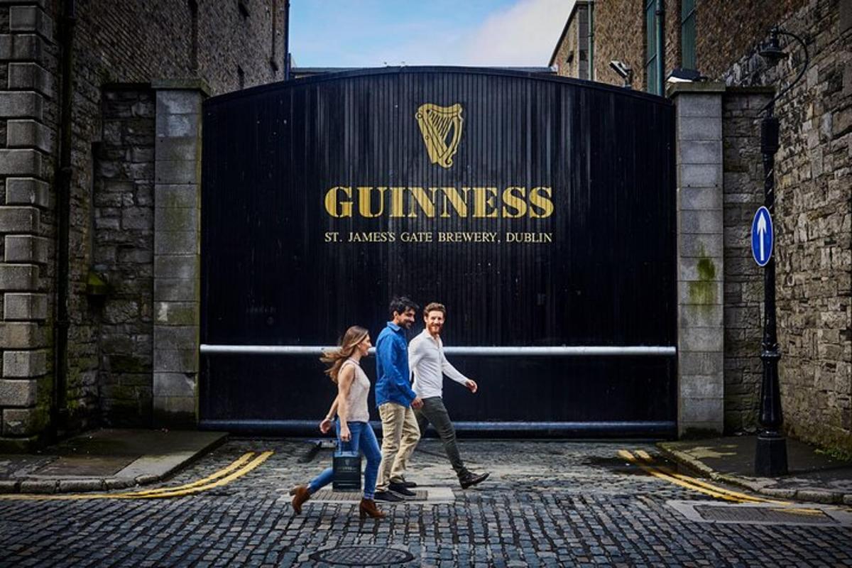 a group of people walking in front of a gate