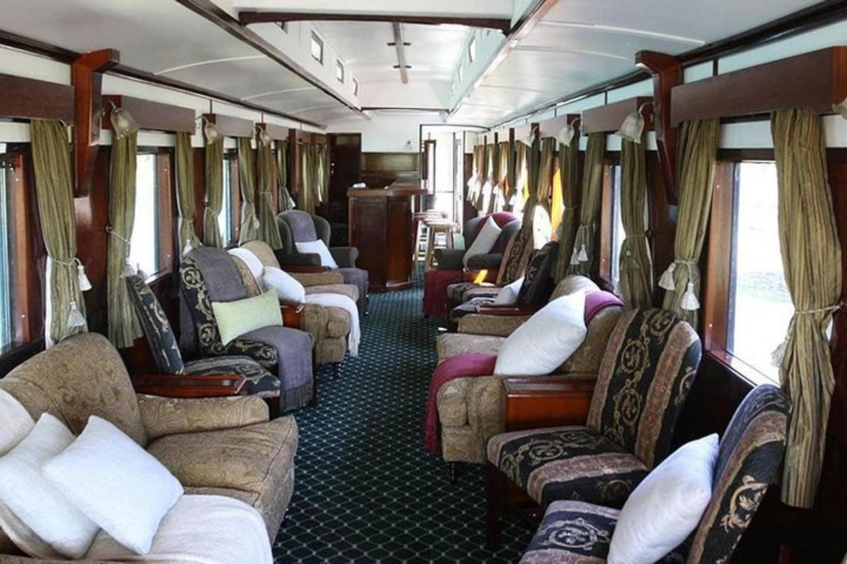 a train car with many chairs and tables