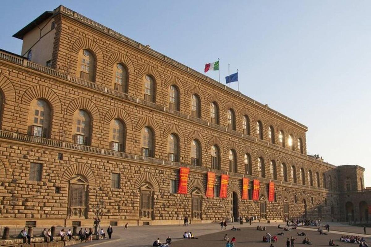 a large brick building with people walking in front of it