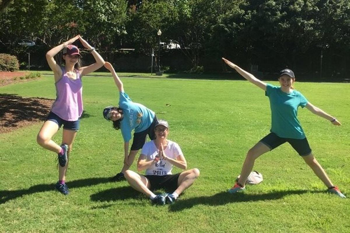 a group of people playing with a frisbee in a field