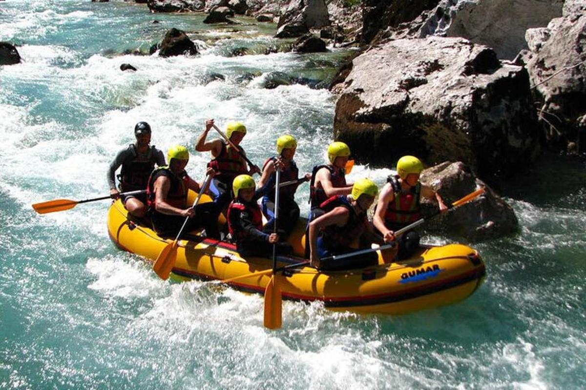 a group of people in a raft on a river