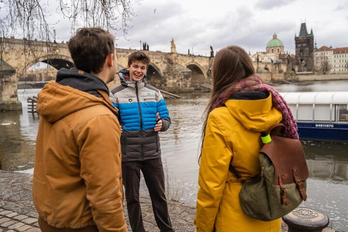 a group of people standing next to a river