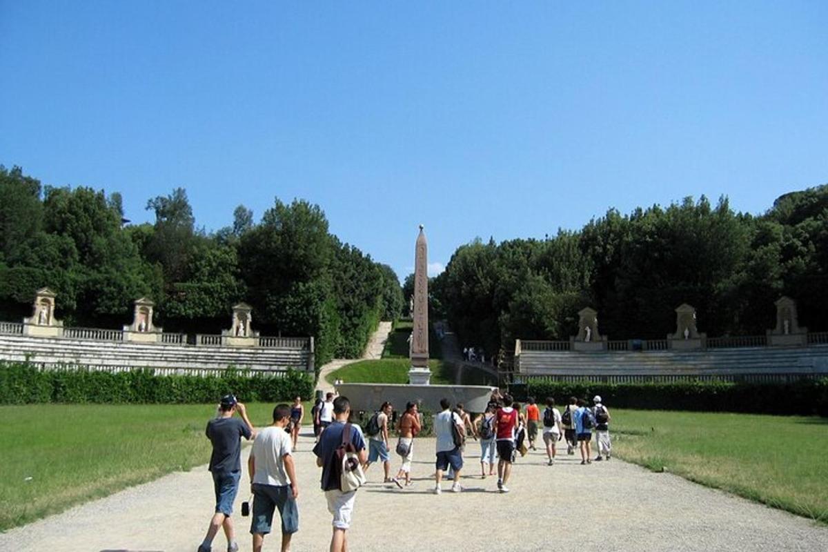 a group of people walking in front of a monument