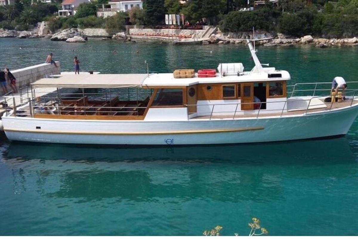 a boat is docked at a dock in the water
