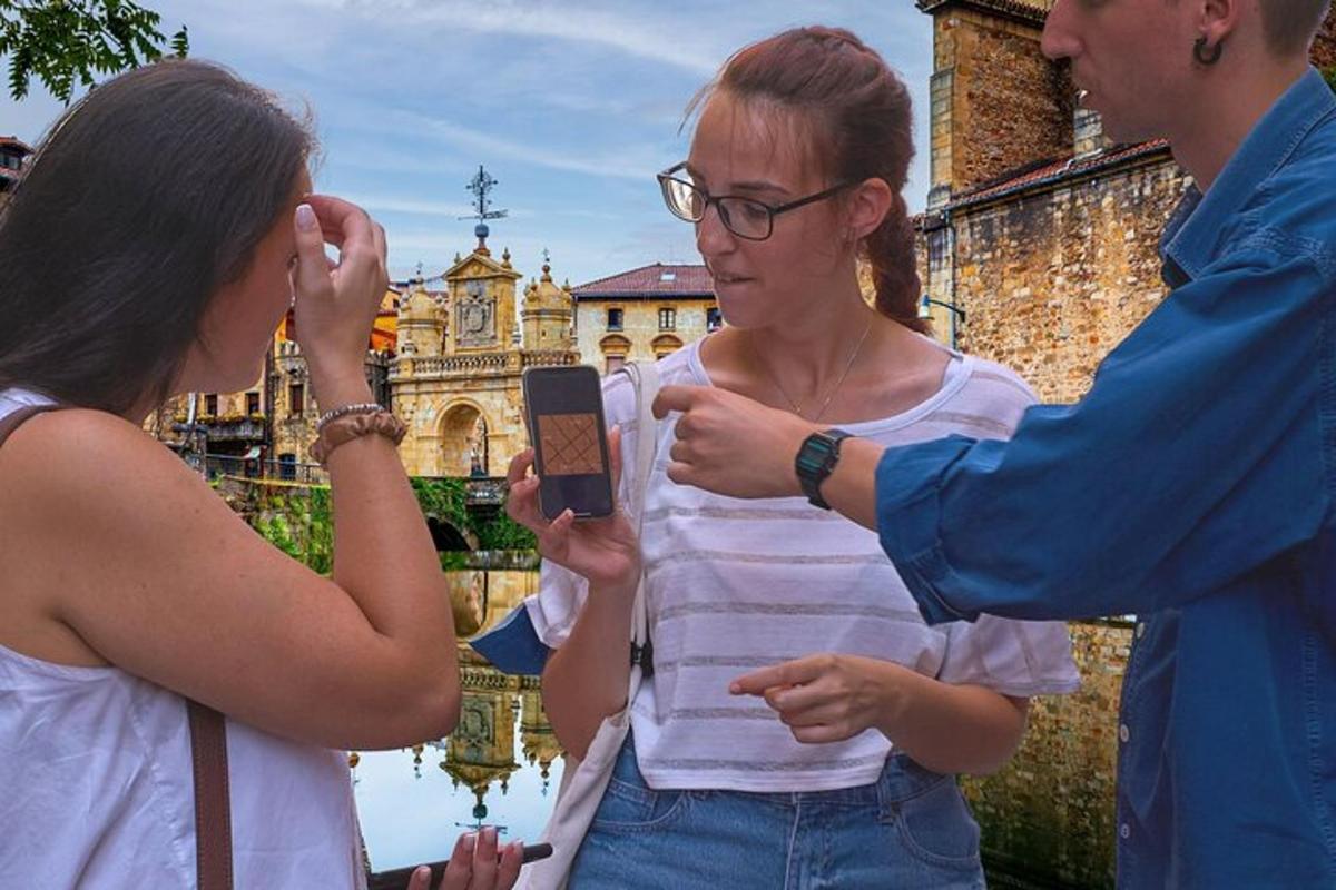 a man and a woman looking at a cell phone
