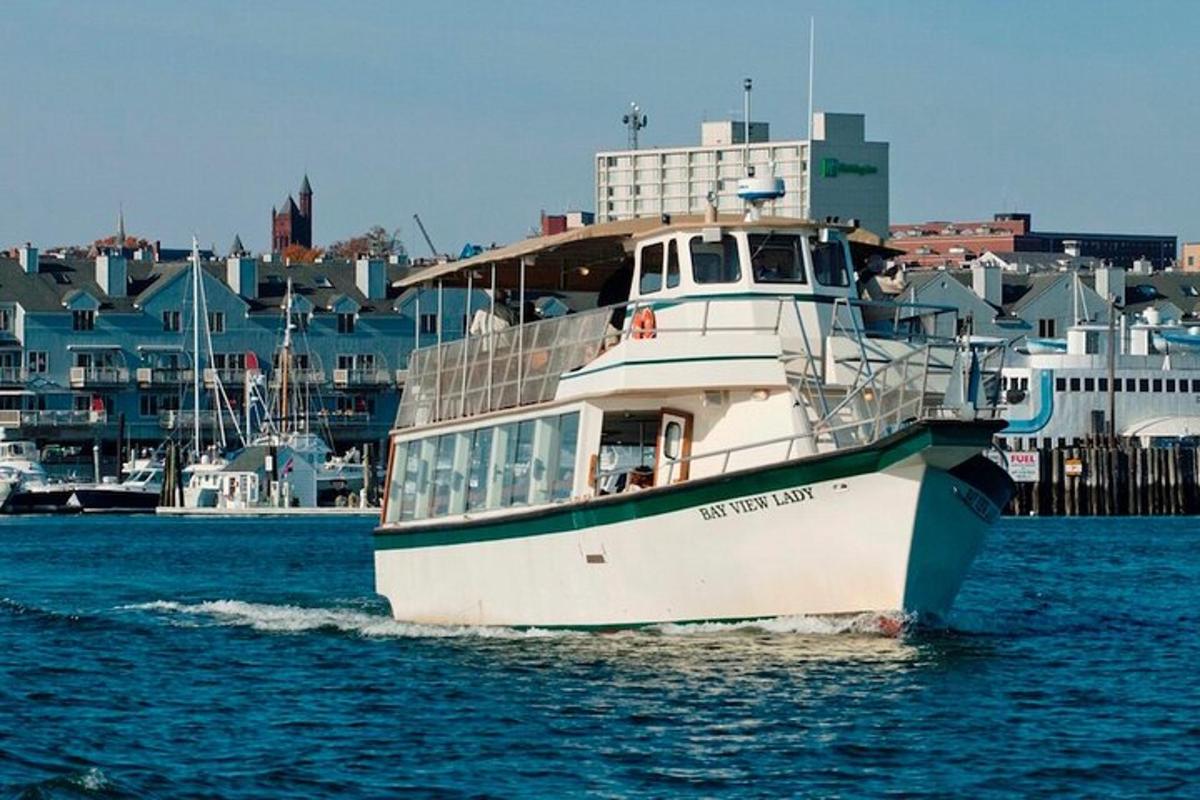 a boat in the water with buildings in the background