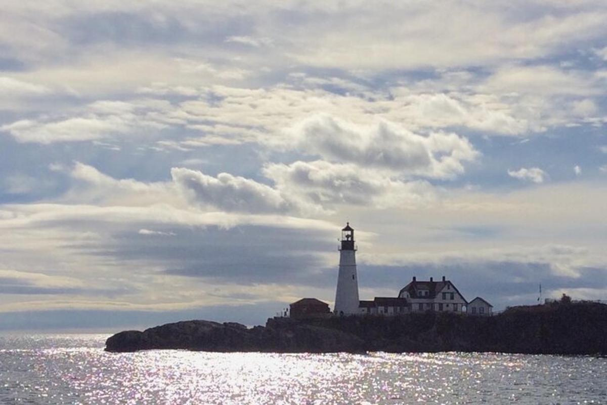 a lighthouse on a small island in the water