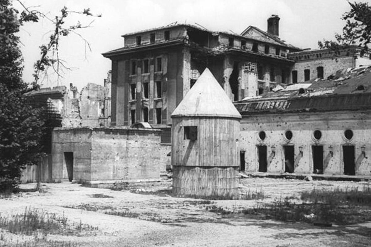 an old photo of a building with a bird house