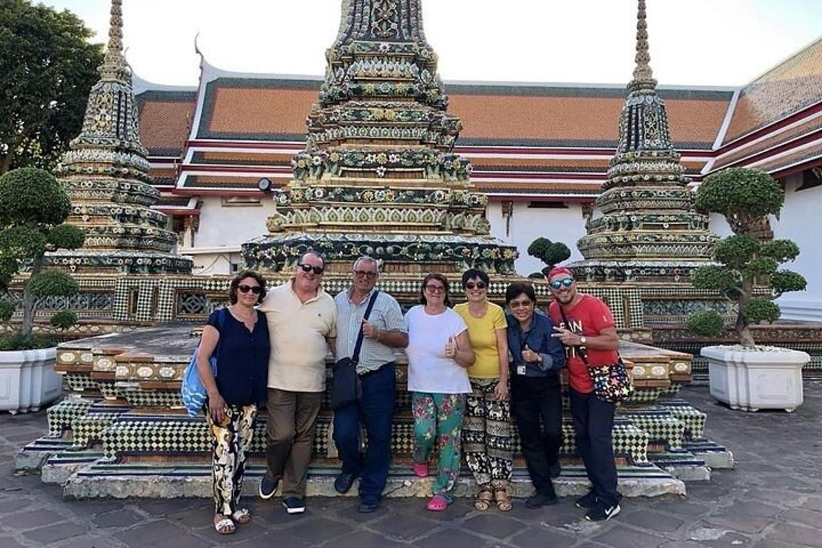 a group of people standing in front of a temple