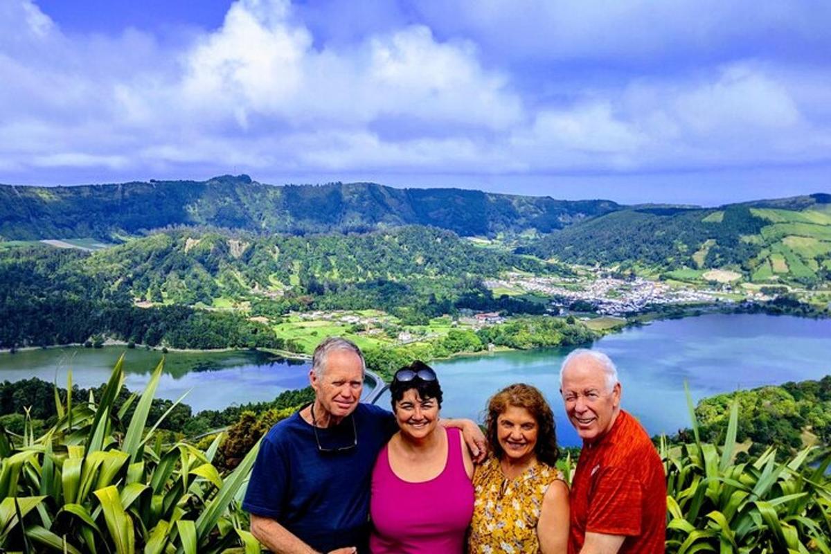 a group of people standing on top of a mountain