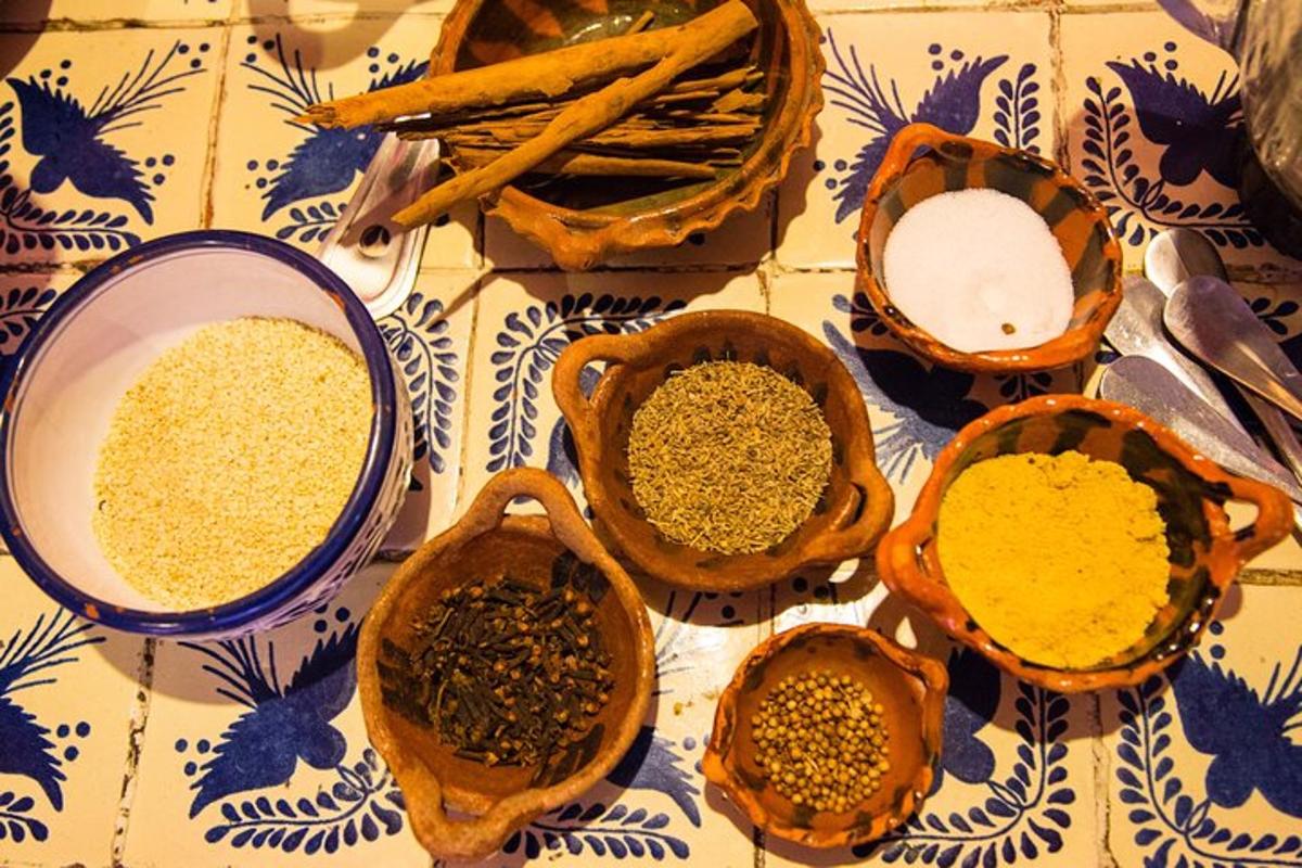 a group of bowls of spices on a table