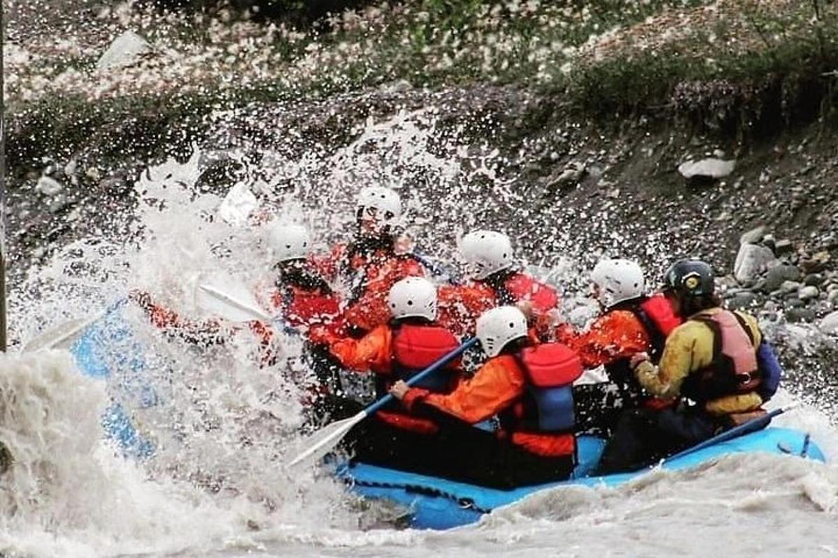 a group of people on a raft in a river