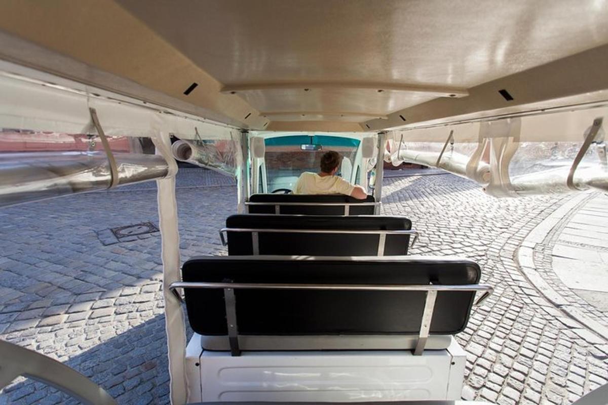 a person sitting in the back of a bus