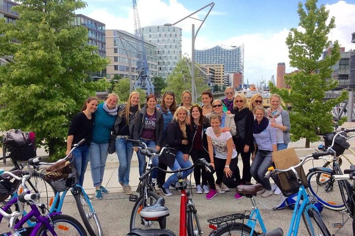 a group of people posing for a picture with their bikes