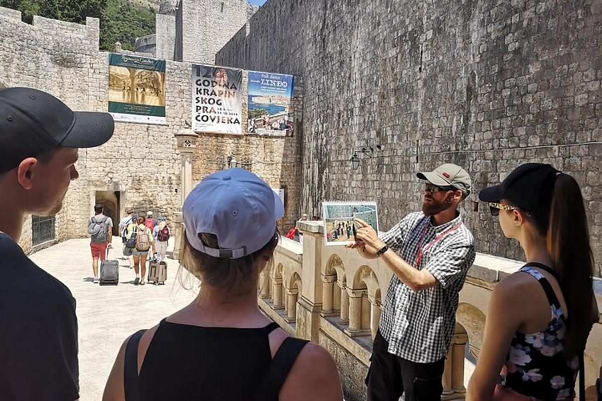 a group of people looking at a man in a castle