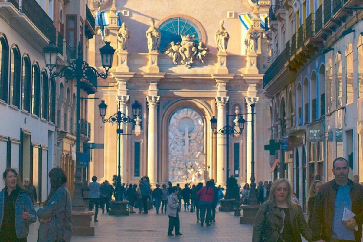 a group of people walking down a street in a building