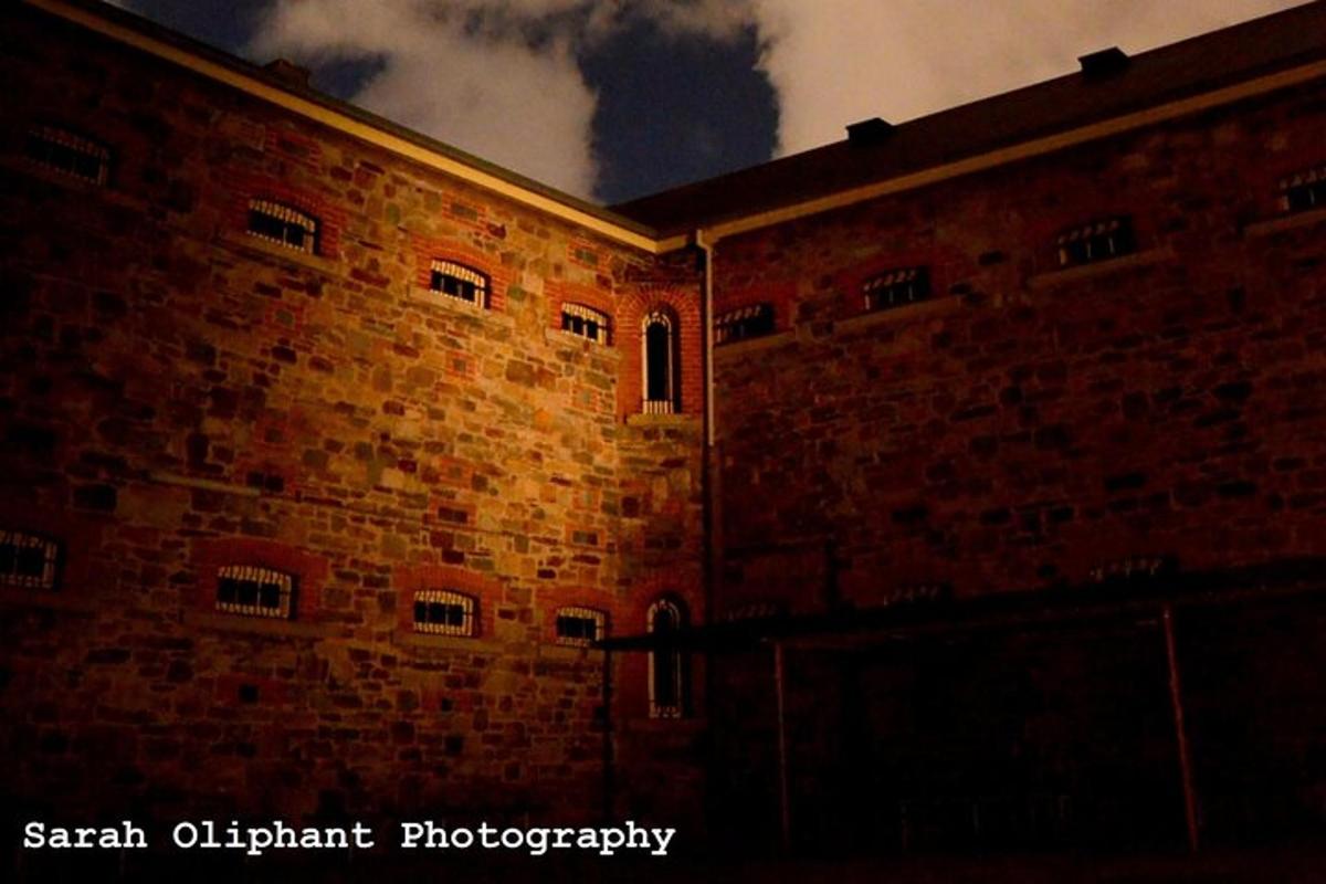 a large brick building with a sky in the background