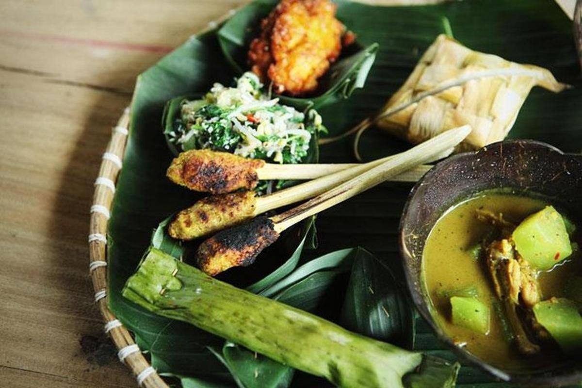 a plate of food with vegetables and a bowl of soup